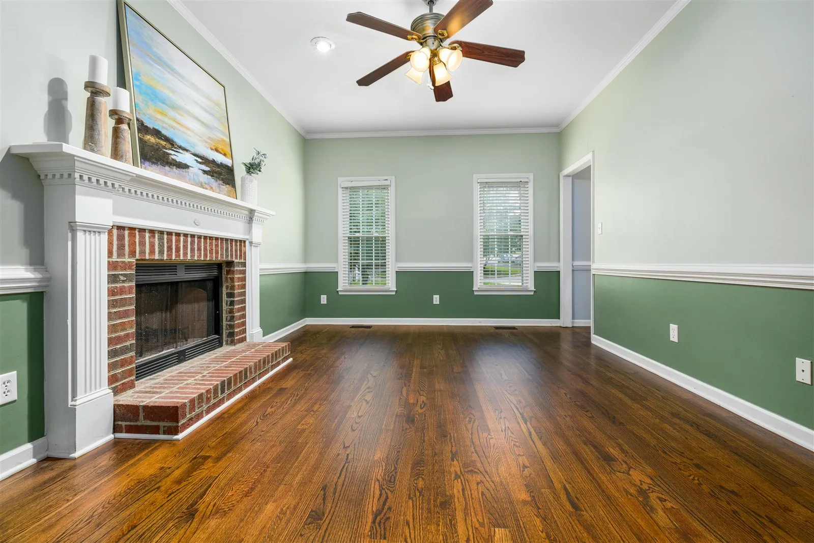 Freshly painted sage green interior room near built-in storage